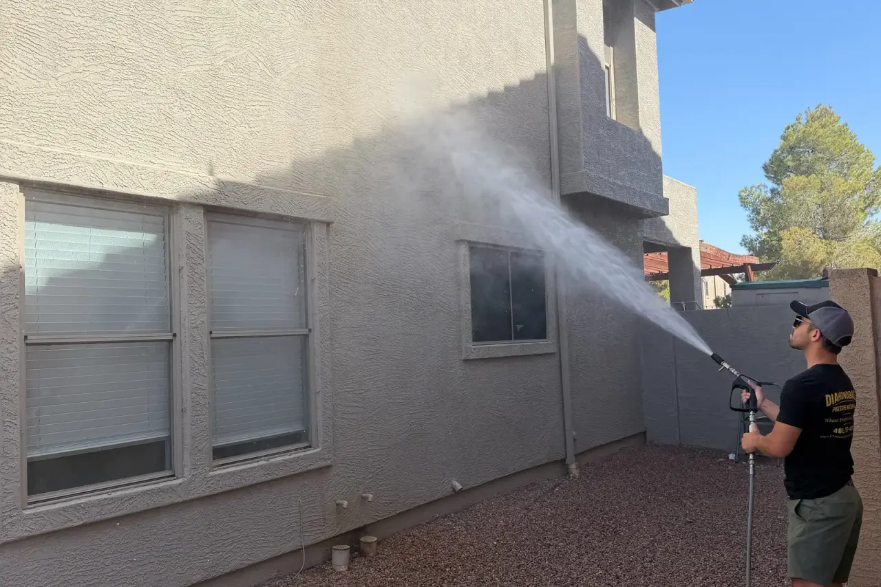 Low-pressure soft wash on a stucco home exterior in Arizona